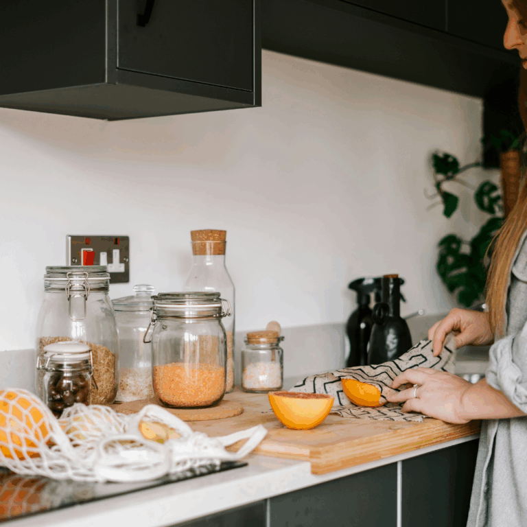 Girl in kitchen with eco swaps that are plastic-free