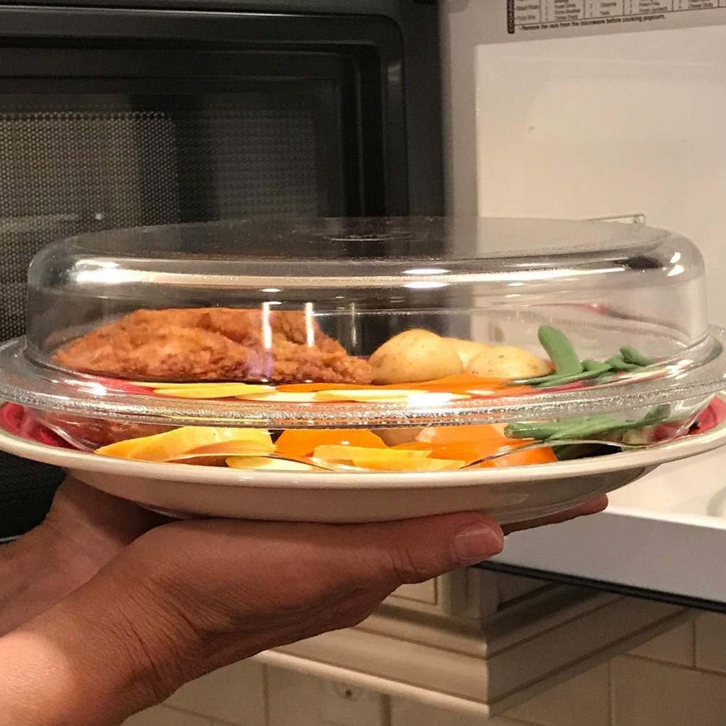 Plastic free microwave cover over a plate of food going into the microwave
