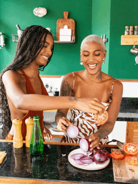 Two girls in the kitchen cooking