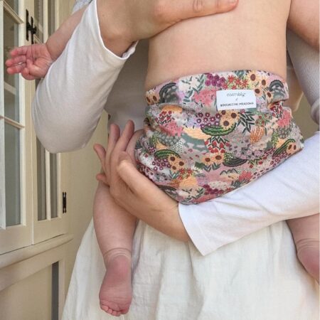 What are the best cloth diapers. Mom holding baby close up of the Esembly Cloth Diaper.