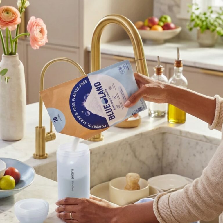 Woman pouring Blueland dishwashing powder into the forever bottle.