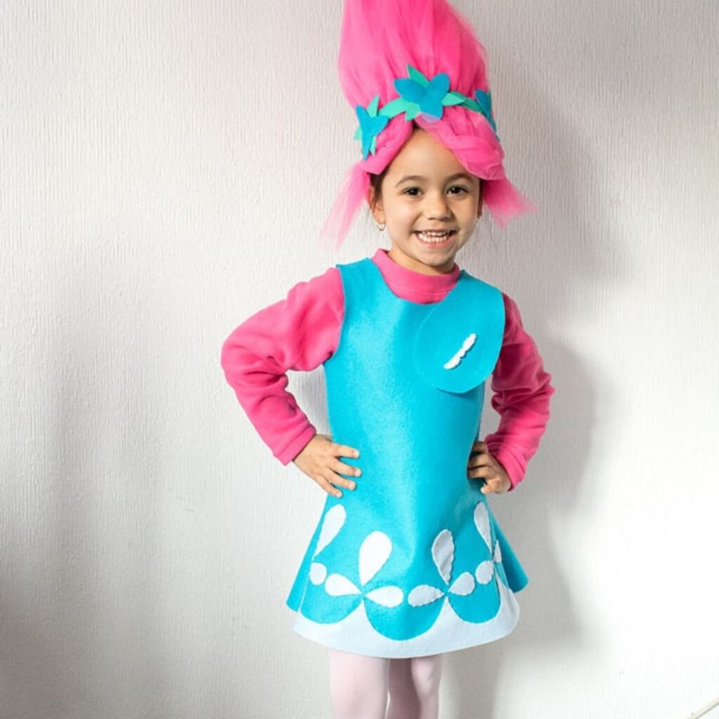 Girl dressed in a Princess Poppy Troll diy costume.