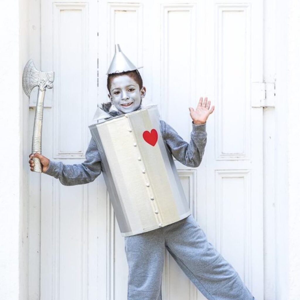Child in a DIY Tin Man costume made from a cardboard box