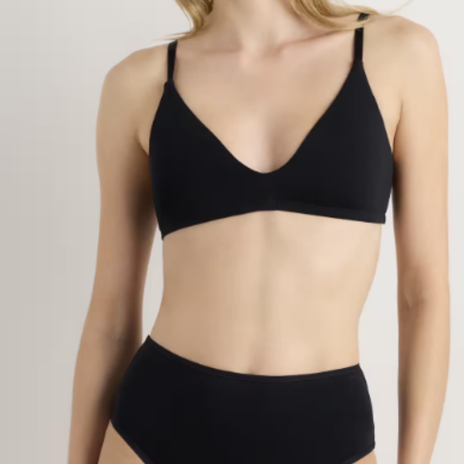 Quince Organic Cotton High-Waisted Brief in black worn with a matching black bralette