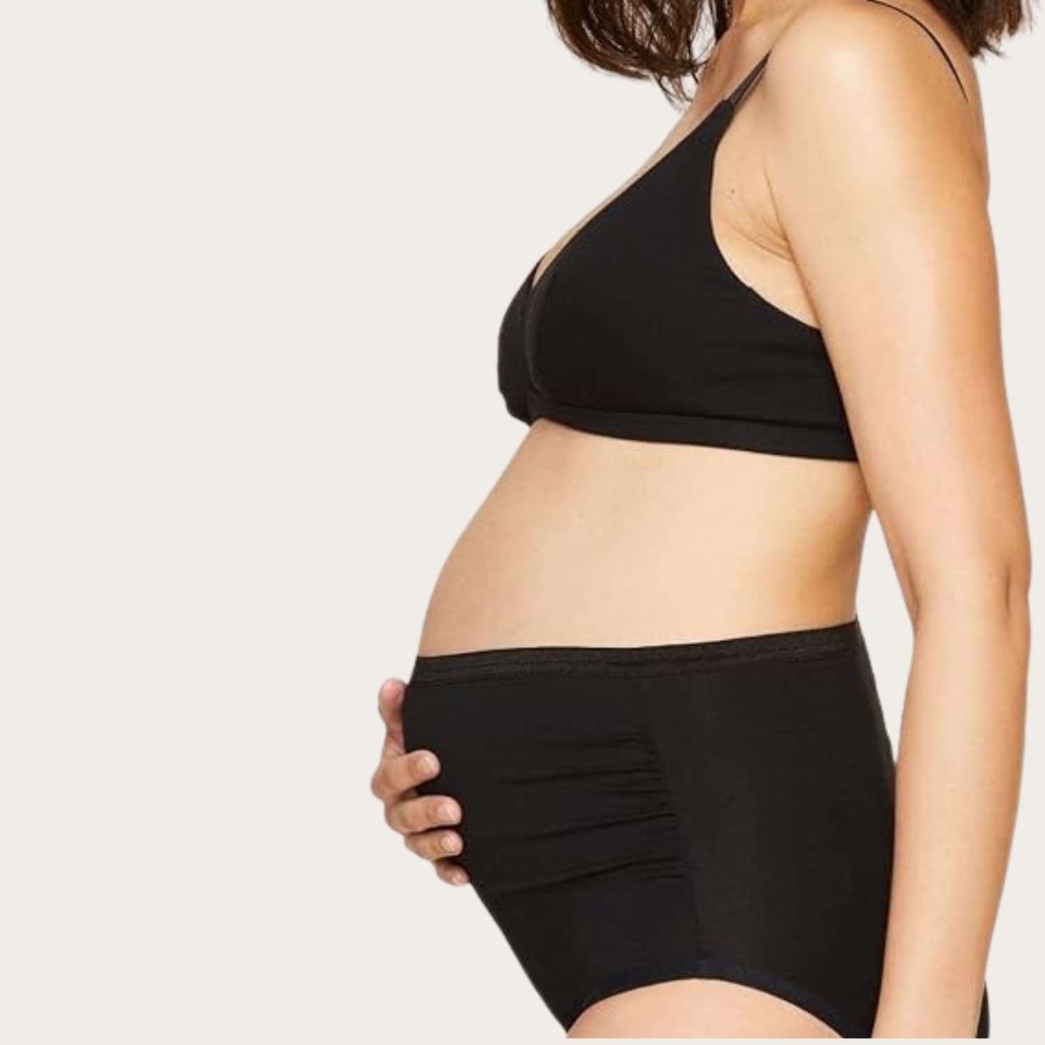 Subset Organic Cotton Maternity Above-Belly Brief in black worn over a pregnant belly