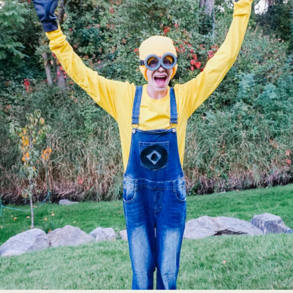 Boy in yard dressed in DIY Minion costume