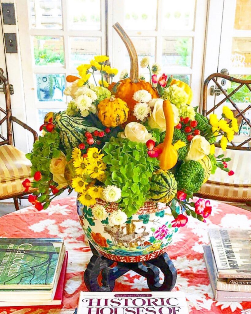 Thanksgiving center pieces with flowers and gourds.
