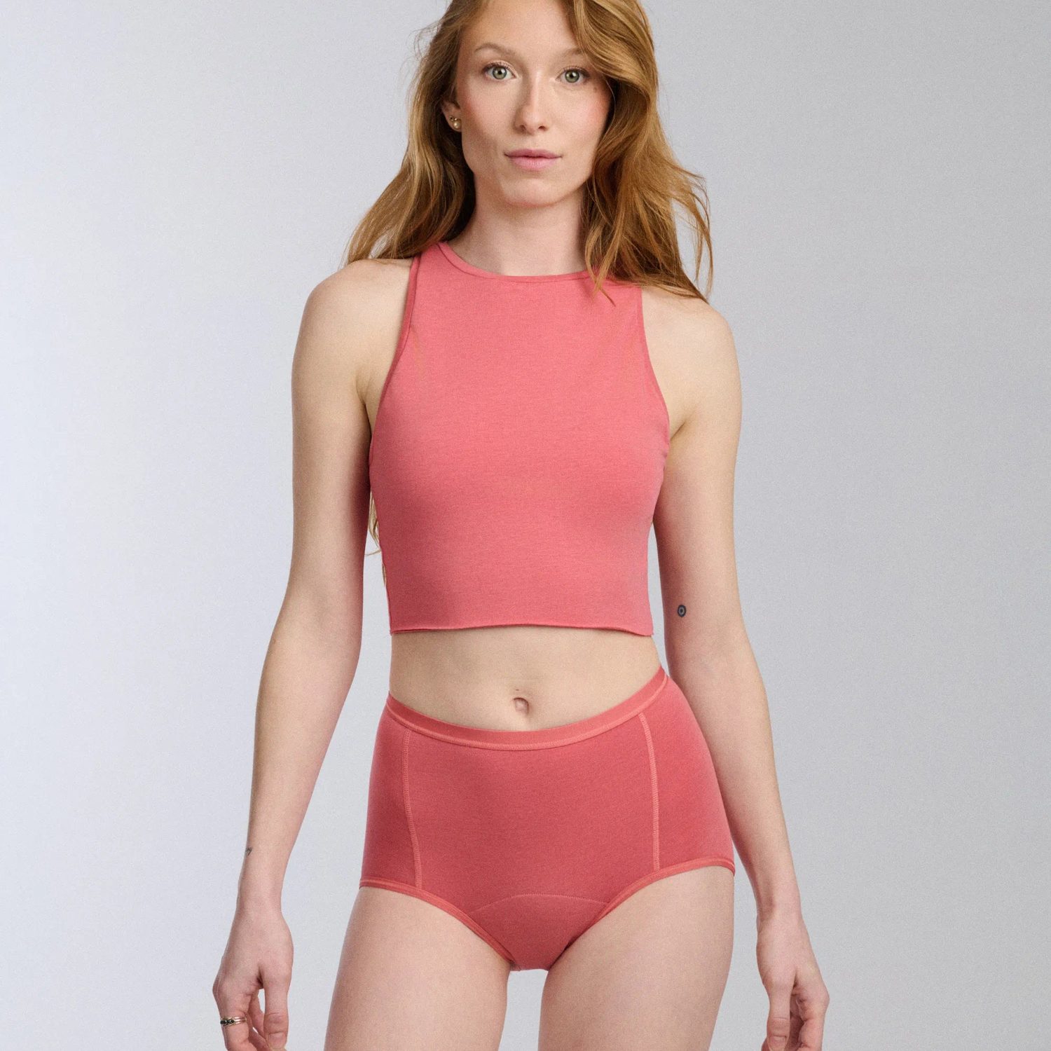 Aisle BOOST Brief period underwear in coral with a matching crop top