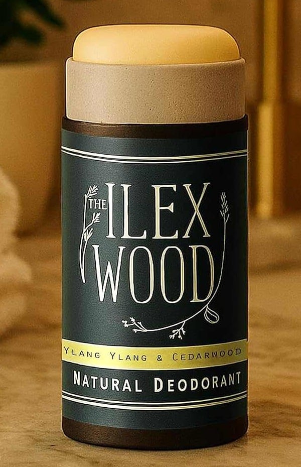 The Ilex Wood Ylang Ylang and Cedarwood natural deodorant in a navy cardboard tube